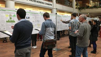 Poster session in the atrium of the Humphrey School